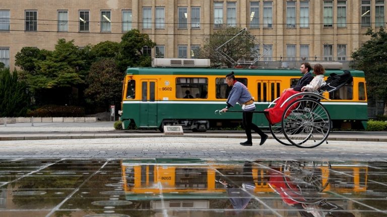 Enjoy a Rickshaw Ride Through Tenmonkan Shopping Street at Dusk While Wearing an Oshima Tsumugi Kimono
