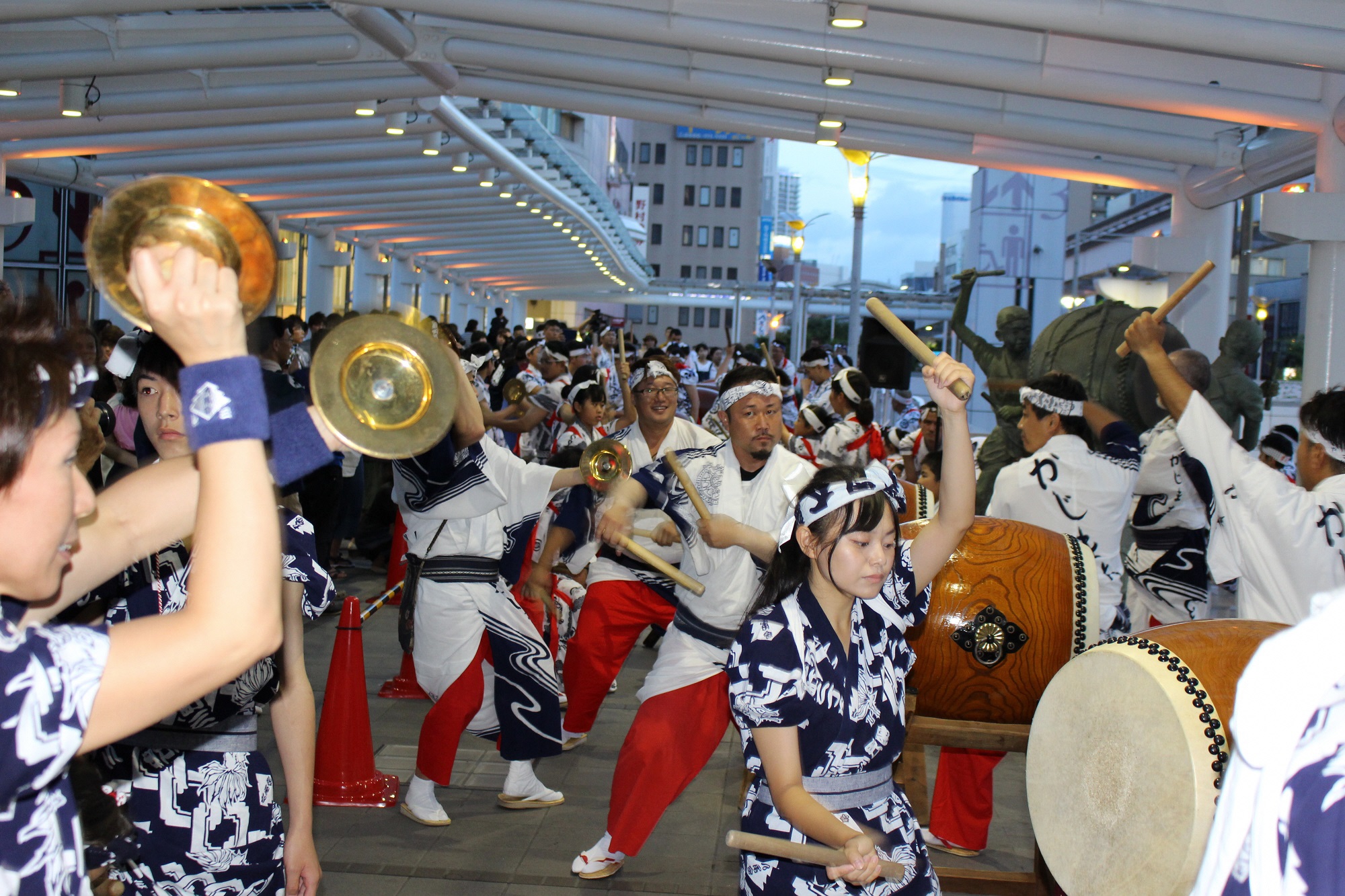 Drummers beating a Kokura Gion Taiko float drum on both faces, Kitakyushu