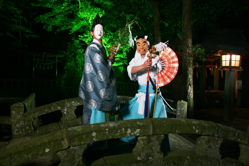 Iki dai-dai kagura performers in ritual costume at night